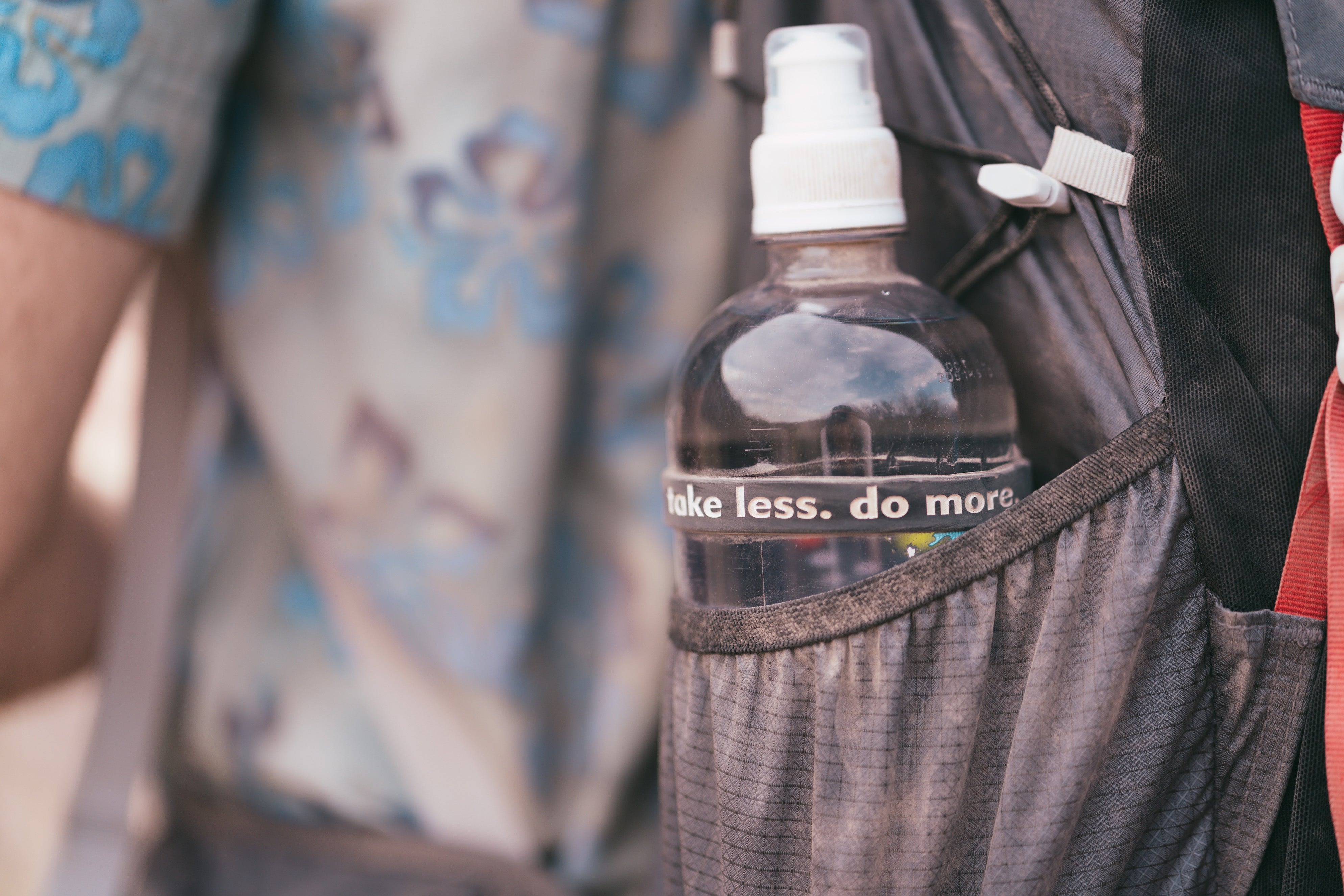 Water bottle with 'take less. do more'
